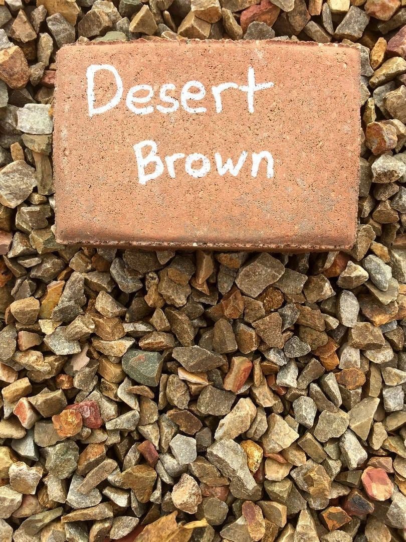 Desert brown stone sample on decorative gravel background for landscaping ideas.