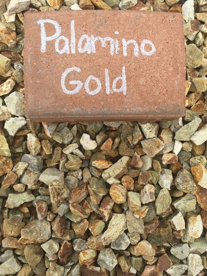 Palamino Gold stone sample on gravel background for landscaping and design projects